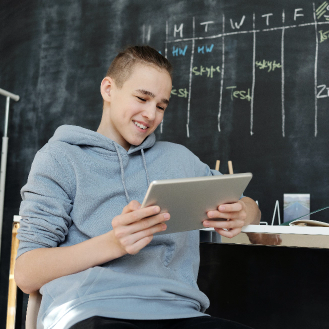 high school student using tablet for teledoc visit